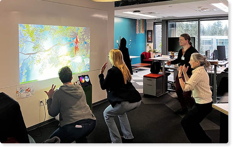 A photo of employees using Breakthru together in the office space
