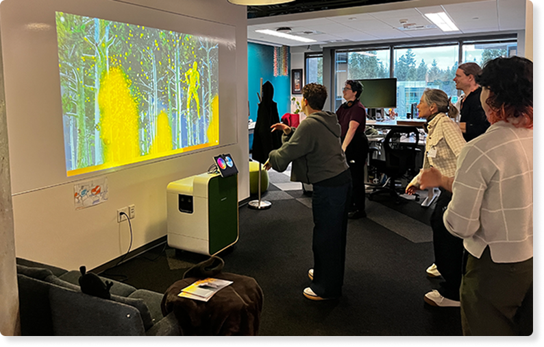 A photo of employees using Breakthru together in the office space