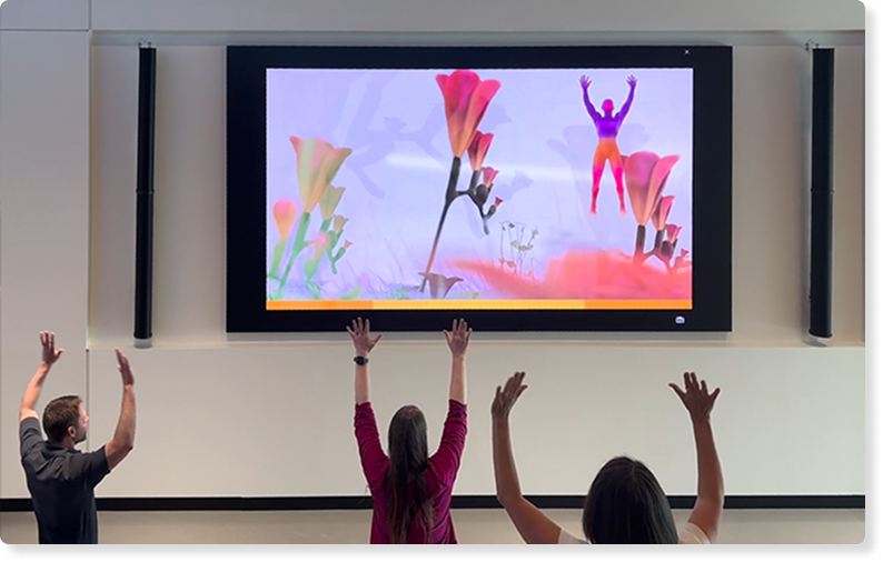 A photo of employees using Breakthru together in the office space